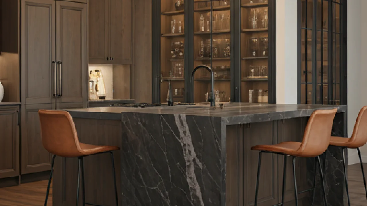 Dark kitchen with marble waterfall island