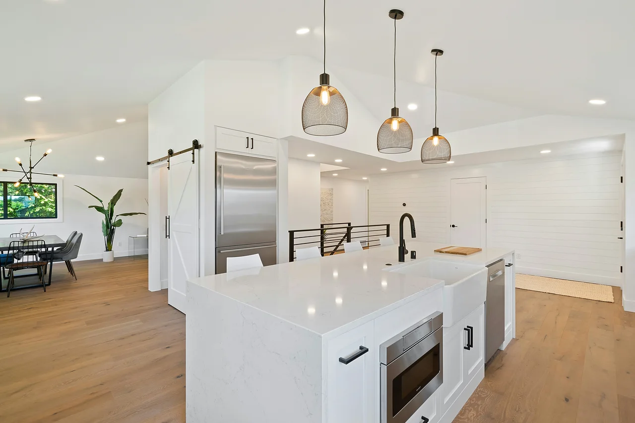Open-concept kitchen remodel with waterfall island